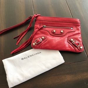 Red Balenciaga wristlet with zipper